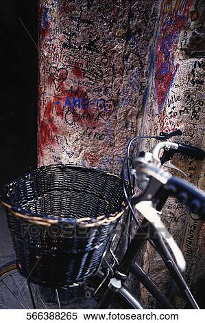 Stock Photography - Close-up of a bicycle leaning against a wall. Fotosearch