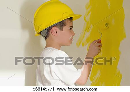 Close-up of a boy painting the wall with a paint roller View Large Photo Image Stock Image - Close-up of a boy painting the wall with a paint roller. Fotosearch