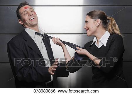 Close-up of a businesswoman and a businessman romancing View Large Photo Image Stock Photograph - Close-up of a businesswoman and a businessman romancing. Fotosearch