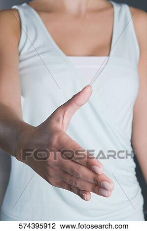 Close-up of a businesswoman offering for handshake View Large Photo Image Stock Image - Close-up of a businesswoman offering for handshake. Fotosearch