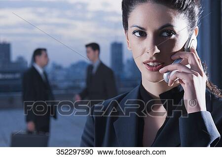 Close-up of a businesswoman talking on a mobile phone View Large Photo Image Stock Image - Close-up of a businesswoman talking on a mobile phone. Fotosearch