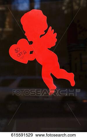 Close-up of a figurine of a cupid, New York City, New York State, USA View Large Photo Image Stock Photo - Close-up of a figurine of a cupid, New York City, New York State, USA. Fotosearch