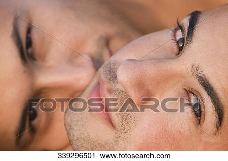 Close-up of a gay couple sleeping together View Large Photo Image Stock Image - Close-up of a gay couple sleeping together. Fotosearch