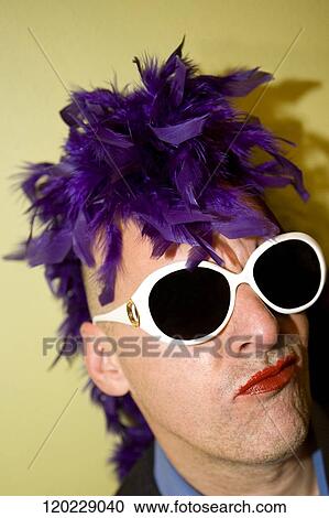 Stock Image - Close-up of a gay man making a face. Fotosearch