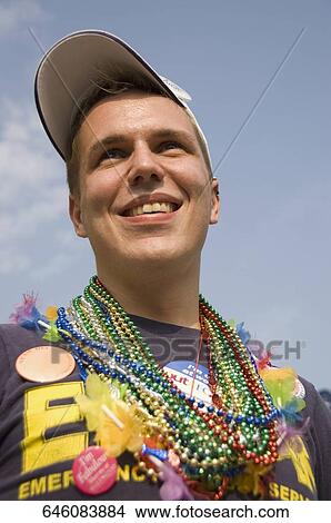 Close-up of a gay man smiling View Large Photo Image Picture - Close-up of a gay man smiling. Fotosearch