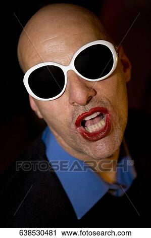 Close-up of a gay man wearing sunglasses View Large Photo Image Stock Image - Close-up of a gay man wearing sunglasses. Fotosearch