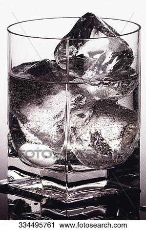Close-up of a glass of wine with ice cubes View Large Photo Image Stock Image - Close-up of a glass of wine with ice cubes. Fotosearch
