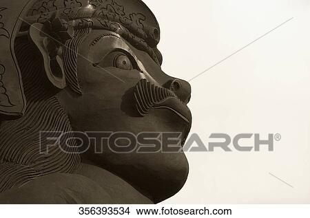 Picture - Close-up of a male statue, Singapore. Fotosearch