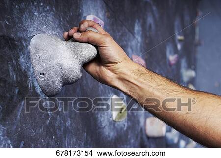 Close-up of a man's hand climbing a wall View Large Photo Image Picture - Close-up of a man's hand climbing a wall. Fotosearch