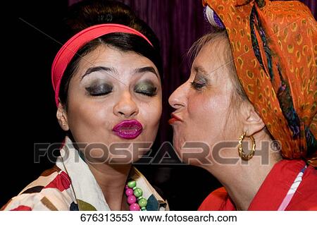 Close-up of a mature woman kissing her daughter View Large Photo Image Stock Image - Close-up of a mature woman kissing her daughter. Fotosearch
