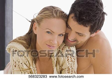 Close-up of a mid adult couple romancing View Large Photo Image Stock Image - Close-up of a mid adult couple romancing. Fotosearch