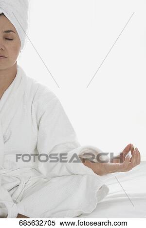 Close-up of a mid adult woman meditating View Large Photo Image Stock Photography - Close-up of a mid adult woman meditating. Fotosearch