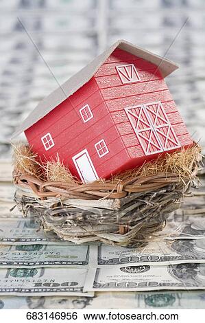 Stock Photograph - Close-up of a model home in a bird's nest. Fotosearch
