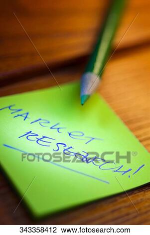 Stock Image - Close-up of a pencil on an adhesive note. Fotosearch