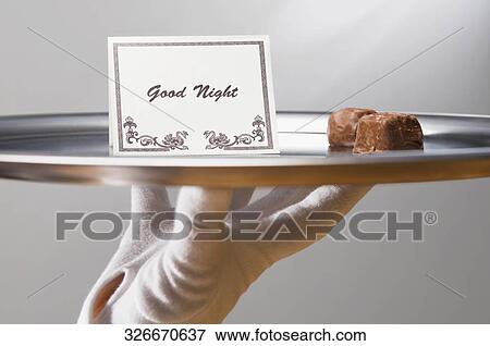 Close-up of a person's hand carrying sweet food and good night note in a plate View Large Photo Image Stock Photo - Close-up of a person's hand carrying sweet food and good night note in a plate. Fotosearch