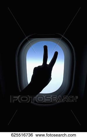 Close-up of a person's hand showing peace sign View Large Photo Image Stock Photograph - Close-up of a person's hand showing peace sign. Fotosearch