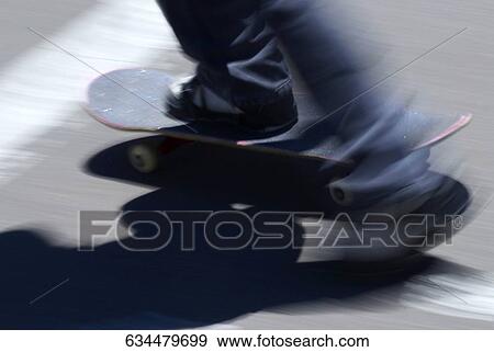 Close-up of a person's legs skateboarding View Large Photo Image Stock Photo - Close-up of a person's legs skateboarding. Fotosearch