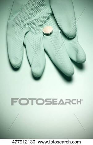 Close-up of a pill on a glove View Large Photo Image Stock Image - Close-up of a pill on a glove. Fotosearch