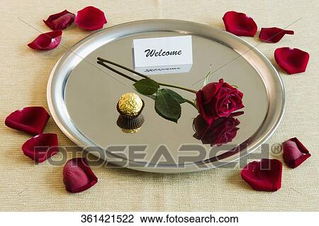 Close-up of a rose with sweet food and welcome note in a plate View Large Photo Image Stock Image - Close-up of a rose with sweet food and welcome note in a plate. Fotosearch