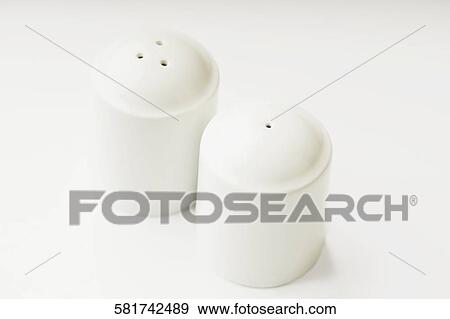 Close-up of a salt shaker and a pepper shaker View Large Photo Image Stock Photo - Close-up of a salt shaker and a pepper shaker. Fotosearch