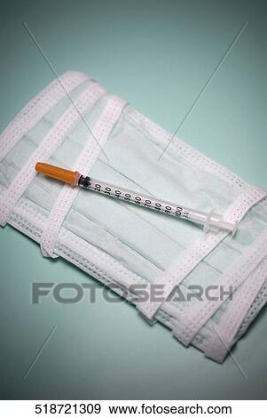 Close-up of a syringe on a bandage View Large Photo Image Stock Photo - Close-up of a syringe on a bandage. Fotosearch