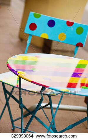 Close-up of a table with a folding chair, Cannes, Provence-Alpes-Cote d'Azur, France View Large Photo Image Picture - Close-up of a table with a folding chair, Cannes, Provence-Alpes-Cote d'Azur, France. Fotosearch