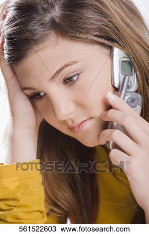 Close-up of a teenage girl talking on a mobile phone View Large Photo Image Stock Image - Close-up of a teenage girl talking on a mobile phone. Fotosearch