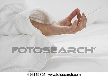 Close-up of a woman practicing yoga View Large Photo Image Stock Photography - Close-up of a woman practicing yoga. Fotosearch
