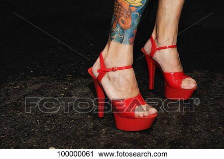 Close-up of a woman's legs wearing stiletto View Large Photo Image Stock Image - Close-up of a woman's legs wearing stiletto. Fotosearch