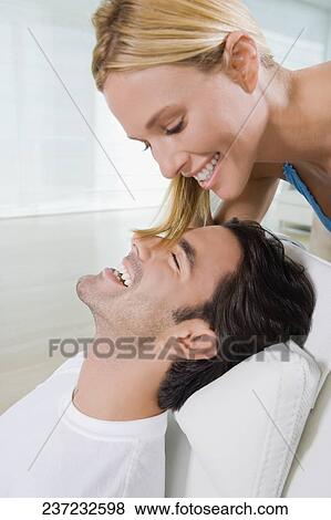 Close-up of a young man and a mid adult woman smiling View Large Photo Image Stock Photo - Close-up of a young man and a mid adult woman smiling. Fotosearch