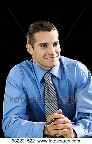 Close-up of a young man smiling View Large Photo Image Stock Image - Close-up of a young man smiling. Fotosearch