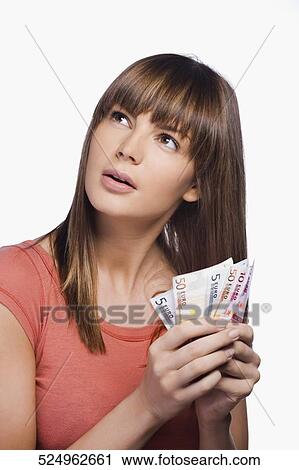 Close-up of a young woman holding Euro banknotes View Large Photo Image Stock Image - Close-up of a young woman holding Euro banknotes. Fotosearch