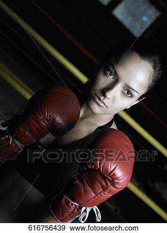 Close-up of a young woman in a boxing ring View Large Photo Image Stock Photo - Close-up of a young woman in a boxing ring. Fotosearch