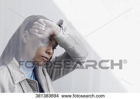 Picture - Close-up of a young woman looking sad. Fotosearch