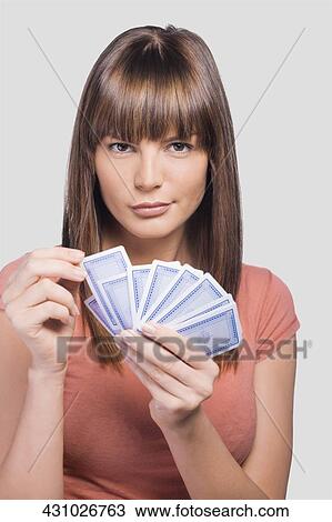 Close-up of a young woman playing cards View Large Photo Image Stock Image - Close-up of a young woman playing cards. Fotosearch