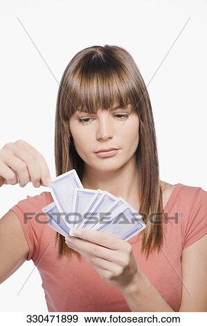 Close-up of a young woman playing cards View Large Photo Image Stock Photo - Close-up of a young woman playing cards. Fotosearch