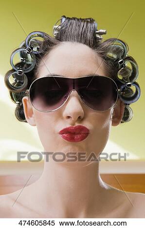 Close-up of a young woman puckering View Large Photo Image Stock Photography - Close-up of a young woman puckering. Fotosearch