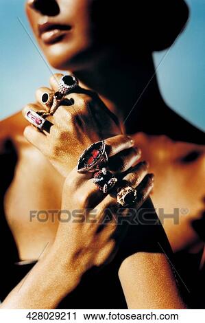 Close-up of a young woman wearing rings View Large Photo Image Stock Image - Close-up of a young woman wearing rings. Fotosearch
