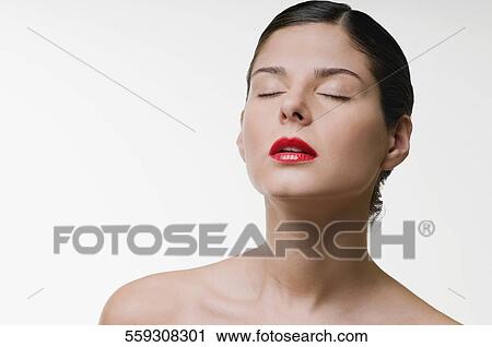 Close-up of a young woman with her eyes closed View Large Photo Image Stock Image - Close-up of a young woman with her eyes closed. Fotosearch