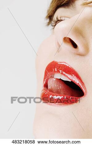 Close-up of a young woman with her mouth open View Large Photo Image Stock Photo - Close-up of a young woman with her mouth open. Fotosearch