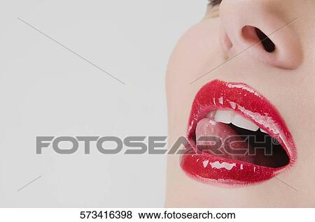Stock Photo - Close-up of a young woman with her mouth open. Fotosearch