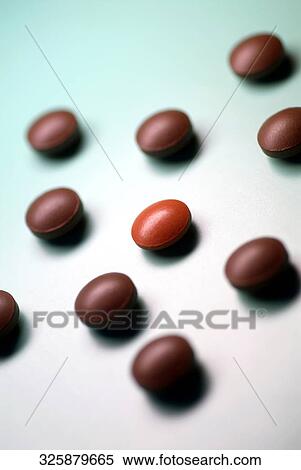 Close-up of brown pills View Large Photo Image Stock Photography - Close-up of brown pills. Fotosearch