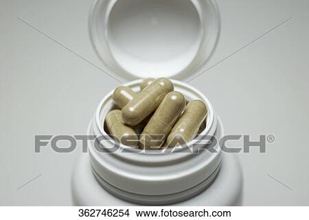 Close-up of capsules in a pill bottle View Large Photo Image Picture - Close-up of capsules in a pill bottle. Fotosearch