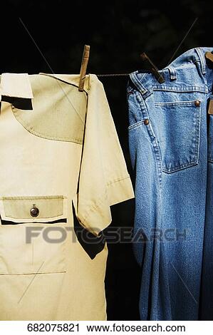 Stock Image - Close-up of clothes hanging on a clothesline. Fotosearch