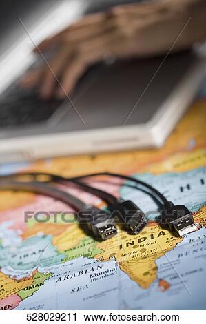 Close-up of computer cables on a world map View Large Photo Image Stock Image - Close-up of computer cables on a world map. Fotosearch