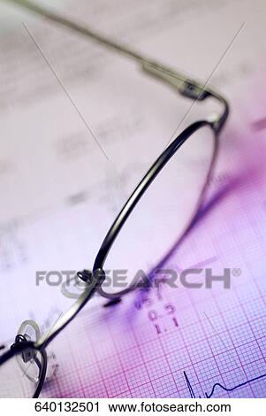 Close-up of eyeglasses on an electrocardiogram report View Large Photo Image Stock Image - Close-up of eyeglasses on an electrocardiogram report. Fotosearch
