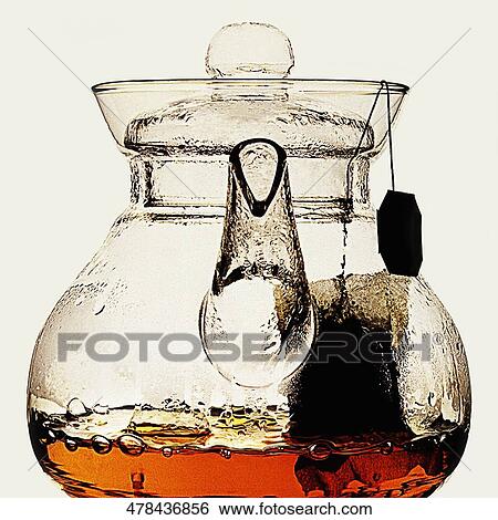 Close-up of herbal tea in a teapot View Large Photo Image Stock Photograph - Close-up of herbal tea in a teapot. Fotosearch