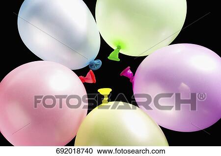 Close-up of multi-colored balloons View Large Photo Image Stock Image - Close-up of multi-colored balloons. Fotosearch