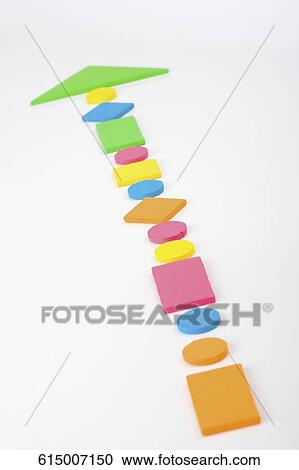 Close-up of objects making an arrow sign View Large Photo Image Stock Image - Close-up of objects making an arrow sign. Fotosearch