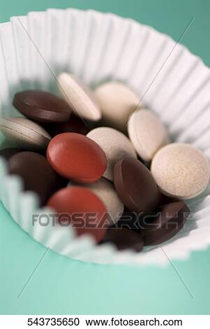 Close-up of pills in a bowl View Large Photo Image Stock Image - Close-up of pills in a bowl. Fotosearch